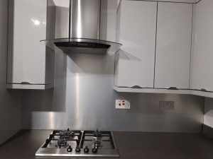 silver aluminium splashback in kitchen