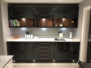 copper and silver splashback in kitchen