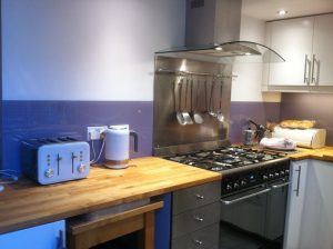 purple splashback in kitchen