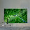 aerial view of bright green forest with winding river Splashback