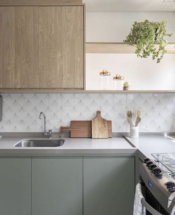 Simple kicthen with green and wood cabinates
