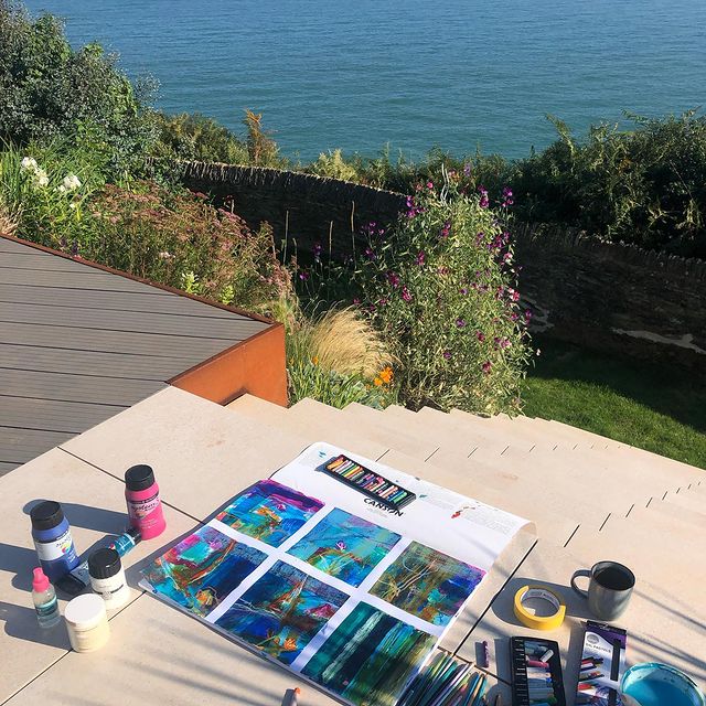 Painting process with a view over the ocean